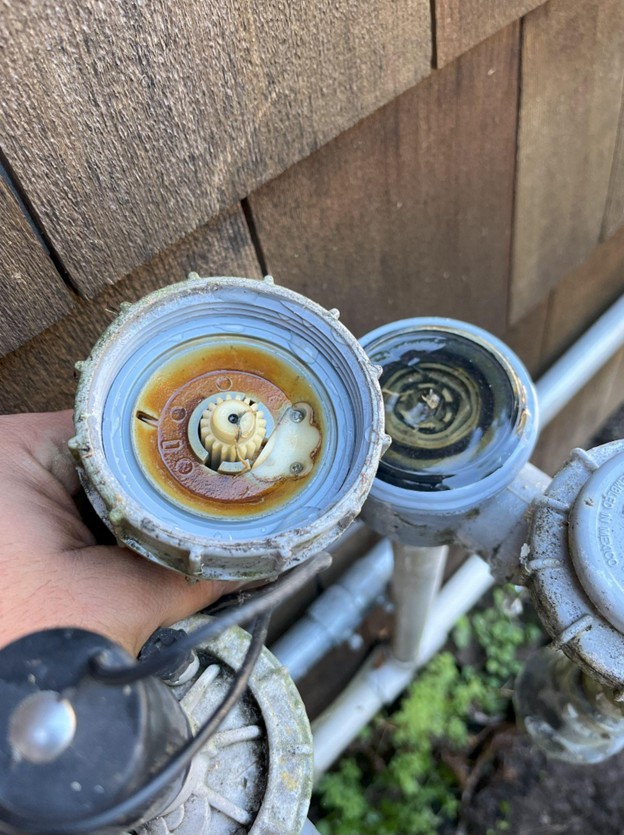 A dirty irrigation valve that requires cleaning maintenance 