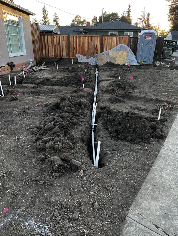 Trenching and lateral lines for lawn sprinklers 