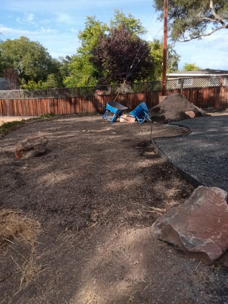 Freshly tilled and amended landscape in Healdsburg, with tilling stopping before a slope to avoid risking erosion on the slope. 