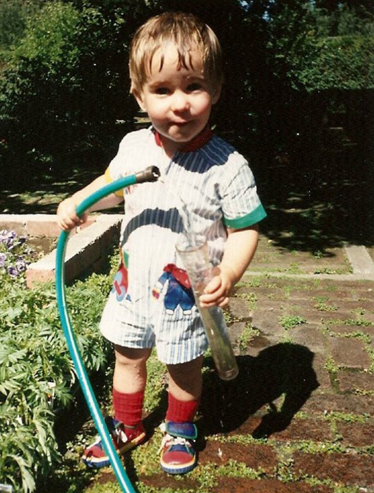 boy holding hose and water tester